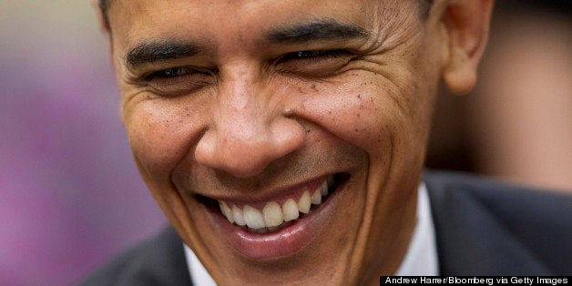 U.S. President Barack Obama smiles while meeting with governors in the Roosevelt Room of the White House in Washington, D.C., U.S., on Tuesday, Dec. 4, 2012. Negotiations over the so-called fiscal cliff are stalled as President Obama and Republicans trade offers on ways to avoid more than $600 billion in U.S. spending cuts and tax increases for 2013 that will start to take effect in January if Congress doesn't act. Photographer: Andrew Harrer/Bloomberg via Getty Images 