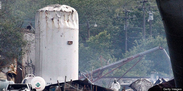 Searchers in protective suits walk through the blast zone of the fertilizer plant that exploded in West, Texas, on Thursday, April 18, 2013. The Wednesday night blast injured dozens, causing an undetermined number of fatalities, as well as massive property damage. (Ron Jenkins/Fort Worth Star-Telegram/MCT via Getty Images)