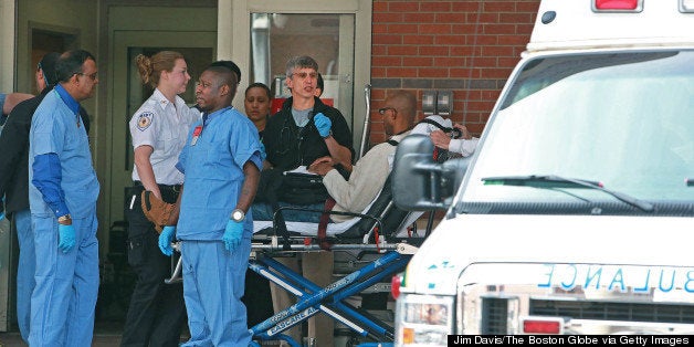 BOSTON - APRIL 15: A man is wheeled into the Emergency Room of Boston Medical Center following the explosions near the finish