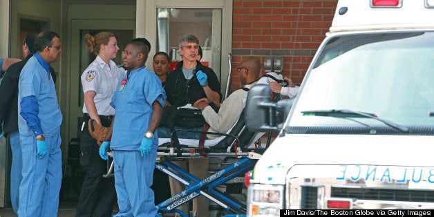 BOSTON - APRIL 15: A man is wheeled into the Emergency Room of Boston Medical Center following the explosions near the finish line of the Boston Marathon. (Photo by Jim Davis/The Boston Globe via Getty Images)