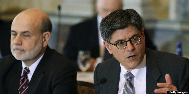 WASHINGTON, DC - APRIL 25: Treasury Secretary Jack Lew (R) speaks while Federal Reserve Chairman Ben Bernanke listens during