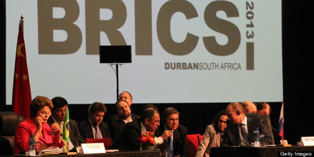 DURBAN, SOUTH AFRICA - MARCH 27: Brazilian President Dilma Rousseff (L), Russian President Vladimir Putin (R), Foreign Minister Sergey Lavrov (C) and other members of Russian and Brazilian delegations are seen during the BRICS Summit on March, 27,2013 in Durban, South Africa. In the fifth summit of the BRICS nations leaders, they talked about forming a development bank to aid developing nations. (Photo by Sasha Mordovets/Getty Images)