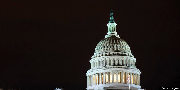 The dome of the U.S. Capitol is lit up in the evening in Washington, D.C., U.S., on Thursday, Feb. 28, 2013. Democrats and Republicans are in a standoff over how avert $85 billion in federal spending cuts set to start before midnight on March 1. Photographer: Pete Marovich/Bloomberg via Getty Images