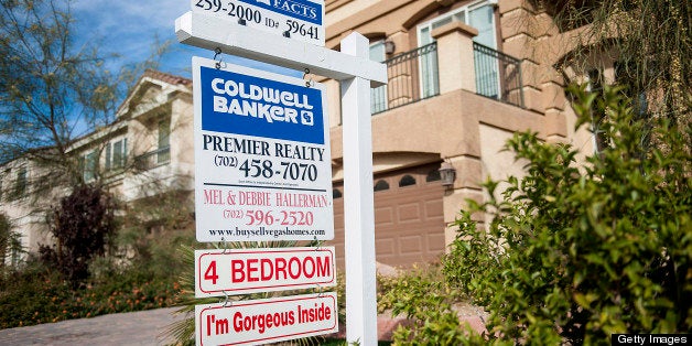 A Coldwell Banker LLC sign is displayed outside of a house for sale in Las Vegas, Nevada, U.S., on Tuesday, Nov. 27, 2012. Las Vegas, the center of the U.S. housing speculation and collapse that sparked a global financial meltdown, is again enticing buyers after a 62 percent price drop, the steepest of any American city. Photographer: Jacob Kepler/Bloomberg via Getty Images