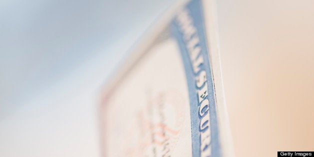 USA, New Jersey, Jersey City, Close up of woman's hand holding social security card