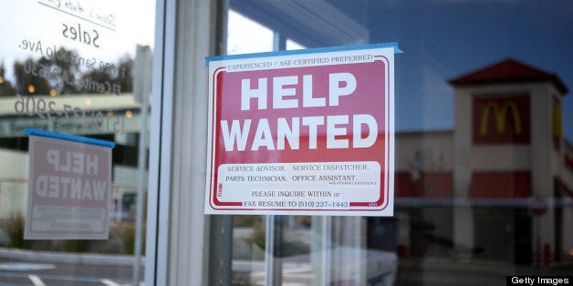 EL CERRITO, CA - MARCH 08: A 'Help Wanted' sign is posted in the window of an automotive service shop on March 8, 2013 in El
