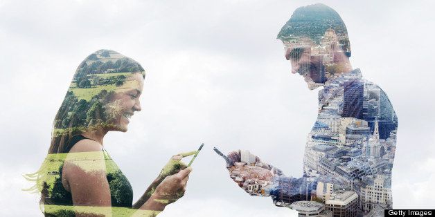 Double exposure of a man and woman using smart phones in different locations. One in the countryside and one in the city.