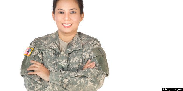 Female American Soldier in Army Camouflage uniform.