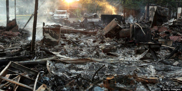 WEST, TX - APRIL 18: Smoke still rises from the rubble of a housenext to the fertilizer plant that exploded yesterday afternoon on April 18, 2013 in West, Texas. According to West Mayor Tommy Muska, around 14 people, including 10 first responders, were killed and more than 150 people were injured when the fertilizer company caught fire and exploded, leaving damaged buildings for blocks in every direction. (Photo by Erich Schlegel/Getty Images)