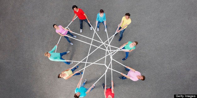 People playing with tangled string