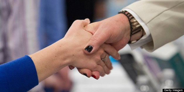 A job seeker shakes hands with a recruiter at the Spring LGBT Career Fair in San Francisco, California, U.S., on Wednesday, A
