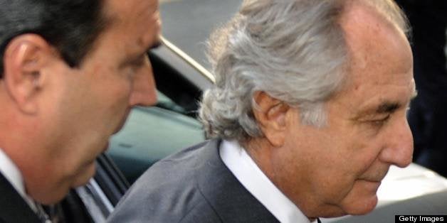 Disgraced Wall Street financier Bernard Madoff (C) arrives at a US Federal Court on March 12, 2009 in New York. Pleading guil