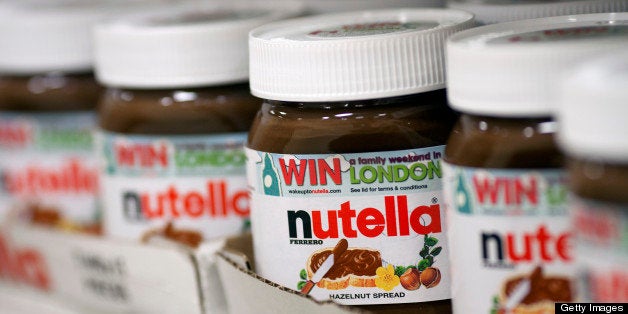 Jars of nutella hazelnut chocolate spread, manufactured by Ferrero SpA, sit in boxes on a shelf inside a supermarket in Sloug