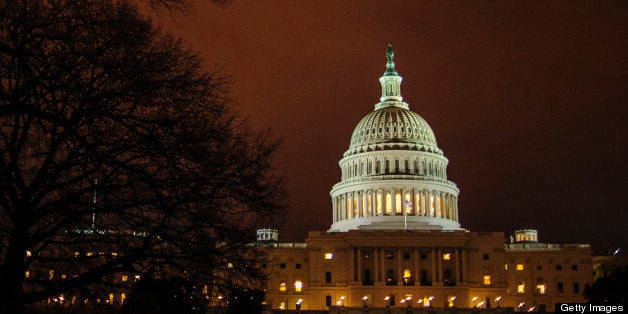The dome of the U.S. Capitol is lit up in the evening in Washington, D.C., U.S., on Thursday, Feb. 28, 2013. Democrats and Republicans are in a standoff over how avert $85 billion in federal spending cuts set to start before midnight on March 1. Photographer: Pete Marovich/Bloomberg via Getty Images