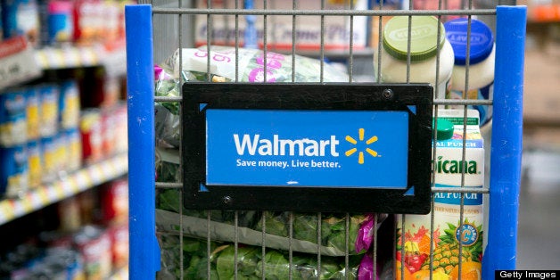 Grocery items sit inside a cart at a Wal-Mart store in Alexandria, Virginia, U.S., on Wednesday, Nov. 14, 2012. Wal-Mart Stores Inc. is scheduled to release earnings data on Nov. 15. Photographer: Andrew Harrer/Bloomberg via Getty Images