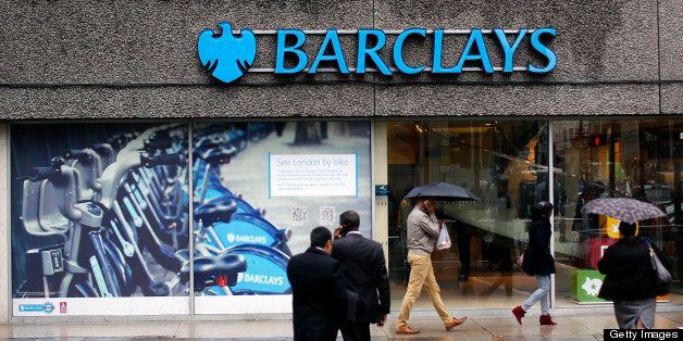 A sign hangs above the windows of a Barclays Plc bank branch in London, U.K., on Tuesday, May 28, 2013. Britain's four biggest banks will have eliminated about 189,000 jobs by the end of this year from their peak staffing levels, bringing employment to a nine-year low amid a dearth of revenue. Photographer: Simon Dawson/Bloomberg via Getty Images