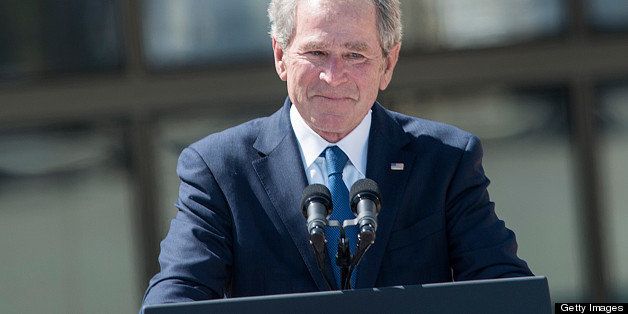 Former US President George W. Bush finishes his speech during a dedication ceremony at the George W. Bush Library and Museum on the grounds of Southern Methodist University April 25, 2013 in Dallas, Texas. The Bush library, which is located on the campus of Southern Methodist University, with more than 70 million pages of paper records, 43,000 artifacts, 200 million emails and four million digital photographs, will be opened to the public on May 1, 2013. AFP PHOTO/Brendan SMIALOWSKI (Photo credit should read BRENDAN SMIALOWSKI/AFP/Getty Images)