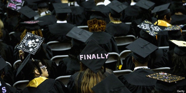 COLLEGE PARK, MD - MAY 17: Graduates of Bowie State University put messages on their mortarboard hats during the school's graduation ceremony at the Comcast Center on the campus of the University of Maryland May 17, 2013 in College Park, Maryland. First lady Michelle Obama delivered the commencement speech for the 600 graduates of Maryland's oldest historically black university and one of the ten oldest in the country. (Photo by Chip Somodevilla/Getty Images)