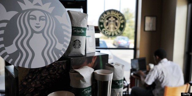 A man works on his computer at a Starbucks coffee shop in Silver Spring, Maryland, on March 28. 2013. The US economy grew more strongly than initially thought in the fourth quarter last year but was still moving at a sluggish 0.4 percent annual pace, the Department of Commerce said on March 28. AFP PHOTO/Jewel Samad (Photo credit should read JEWEL SAMAD/AFP/Getty Images)