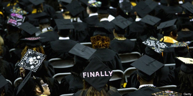 COLLEGE PARK, MD - MAY 17: Graduates of Bowie State University put messages on their mortarboard hats during the school's graduation ceremony at the Comcast Center on the campus of the University of Maryland May 17, 2013 in College Park, Maryland. First lady Michelle Obama delivered the commencement speech for the 600 graduates of Maryland's oldest historically black university and one of the ten oldest in the country. (Photo by Chip Somodevilla/Getty Images)