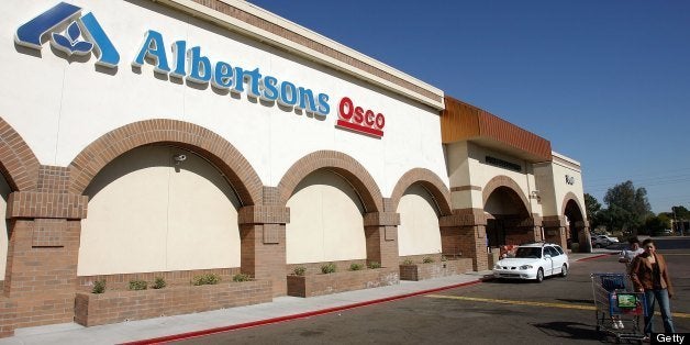 TEMPE, AZ - JANUARY 23: A customer leaves an Albertsons store January 23, 2006 in Tempe, Arizona. An investment group that includes grocery store operator Supervalu Inc. and the drugstore chain CVS Corp. announced Monday it would buy Albertsons for $17.4 billion in cash, stock and debt. (Photo by Ethan Miller/Getty Images)