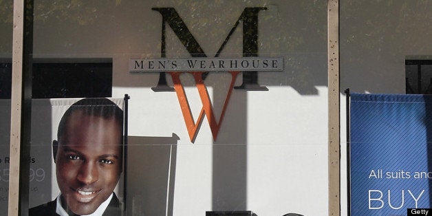 OAKLAND, CA - NOVEMBER 02: A sign hangs in the window of a Men's Wearhouse store in solidarity with Occupy Oakland's general