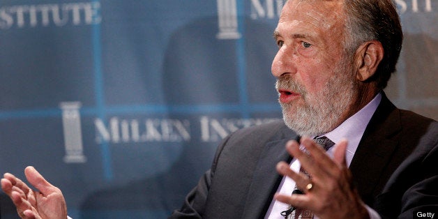 George Zimmer, founder and executive chairman of The Men's Wearhouse Inc., speaks during a panel discussion at the annual Milken Institute Global Conference in Beverly Hills, California, U.S., on Tuesday, May 1, 2012. The conference brings together hundreds of chief executive officers, senior government officials and leading figures in the global capital markets for discussions on social, political and economic challenges. Photographer: Patrick Fallon/Bloomberg via Getty Images