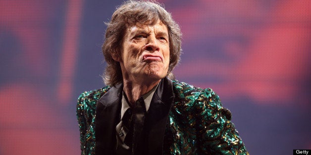 GLASTONBURY, ENGLAND - JUNE 29: Sir Mick Jagger of The Rolling Stones performs on the Pyramid Stage at Glastonbury Festival 2013 on June 29, 2013 in Glastonbury, England. at the Glastonbury Festival of Contemporary Performing Arts site at Worthy Farm, Pilton on June 29, 2013 near Glastonbury, England. The wholesale market caters for traders throughout the Festival who are estimated to provide 3 million meals for festival goers, crew and performers. Gates opened on Wednesday at the Somerset diary farm that will be playing host to one of the largest music festivals in the world and this year features headline acts Artic Monkeys, Mumford and Sons and the Rolling Stones. Tickets to the event which is now in its 43rd year sold out in minutes and that was before any of the headline acts had been confirmed. The festival, which started in 1970 when several hundred hippies paid 1 GBP to watch Marc Bolan, now attracts more than 175,000 people over five days. (Photo by Matt Cardy/Getty Images)