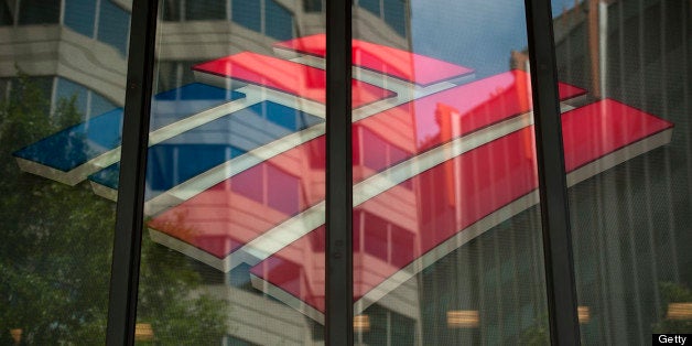 The Bank of America Corp. logo is displayed inside of a branch in Charlotte, North Carolina, U.S., on Wednesday, May 8, 2013. Bank of America Corp. needs to show a steady stream of profit before satisfying demands for a higher dividend, Chief Executive Officer Brian T. Moynihan said during the annual shareholders meeting today. Photographer: Davis Turner/Bloomberg via Getty Images