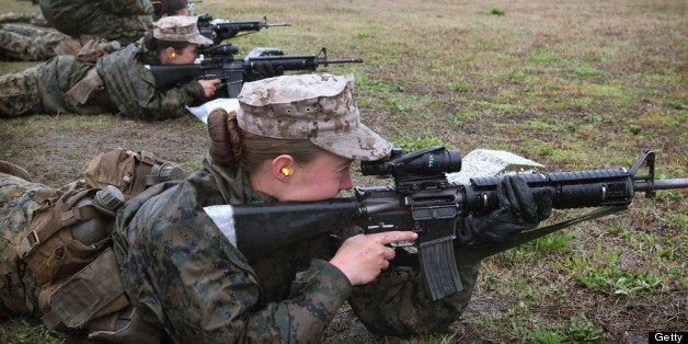 PARRIS ISLAND, SC - FEBRUARY 25: Female Marine recruits fire on the rifle range during boot camp February 25, 2013 at MCRD Parris Island, South Carolina. All female enlisted Marines and male Marines who were living east of the Mississippi River when they were recruited attend boot camp at Parris Island. About six percent of enlisted Marines are female. (Photo by Scott Olson/Getty Images)