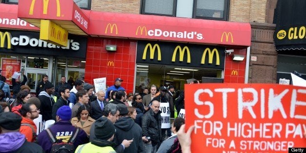 A coalition of groups rally in front of a McDonald's on East 125th Street and Lexington Avenue in Harlem during a protest by fast food workers and supporters for higher wages April 4, 2013 in New York. The protest was held on the 45th anniversary of the assasination of civil rights leader Martin Luther King, Jr. AFP PHOTO/Stan HONDA (Photo credit should read STAN HONDA/AFP/Getty Images)