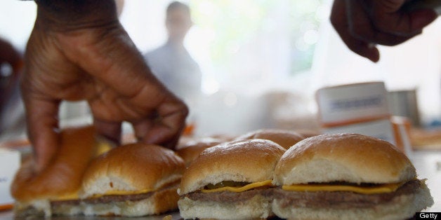 WASHINGTON, DC - JUNE 14: White Castle employees cook their slider burgers before delivering them at the U.S. Capitol to celebrate the company's 90th anniversary with a 'Castles at the Capitol' event June 14, 2011 in Washington, DC. Representatives of the Columbus, Ohio-based company hand-delivered their slider burgers to waiting congressional employees during their lunch hour. (Photo by Win McNamee/Getty Images)