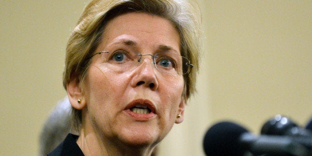 US Senator Elizabeth Warren ,D-MA, speaks at a press conference April 16, 2013 in Boston, Massachusetts, in the aftermath of two explosions that struck near the finish line of the Boston Marathon April 15. The number of casualties in a Monday's bombings at the Boston marathon has risen to 176, police said Tuesday. Three people were killed. AFP PHOTO/Stan HONDA (Photo credit should read STAN HONDA/AFP/Getty Images)