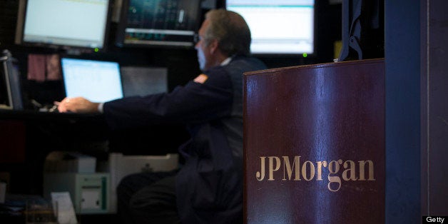 The JP Morgan logo is displayed on the floor of the New York Stock Exchange (NYSE) in New York, U.S., on Monday, July 29, 2013. U.S. stocks fell, paring the biggest monthly gain since October 2011 for the Standard & Poor's 500 Index, as fewer Americans signed contracts in June to buy previously owned homes. Photographer: Scott Eells/Bloomberg via Getty Images