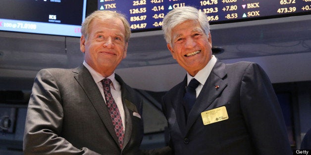 NEW YORK, NY - JULY 29: Publicis CEO Maurice Levy (right) and Omnicom CEO John Wren pose for photographers on the floor of the New York Stock Exchange a day after announcing that Omnicom Group and Publicis Groupe will merge to form the world's largest advertising holding company on July 29, 2013 in New York City. Assuming the deal is apporved, the company will be called Publicis Omnicom Group and be led by both Wren and Levy. (Photo by Spencer Platt/Getty Images)