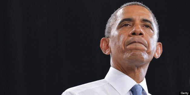 US President Barack Obama pauses as he speaks on home ownership for the middle class at Desert Vista High School on August 6, 2013 in Phoenix, Arizona. AFP PHOTO/Mandel NGAN (Photo credit should read MANDEL NGAN/AFP/Getty Images)