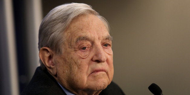 George Soros, founder of Soros Fund Management LLC, pauses while speaking during a forum session on the opening day in Davos, Switzerland, on Wednesday, Jan. 23, 2013. World leaders, Influential executives, bankers and policy makers attend the 43rd annual meeting of the World Economic Forum in Davos, the five day event runs from Jan. 23-27. Photographer: Chris Ratcliffe/Bloomberg via Getty Images 