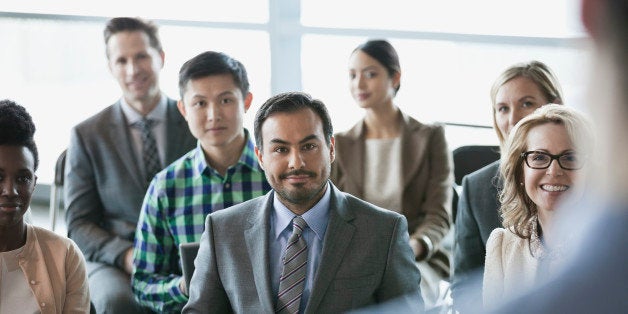 Group of business people at presentation in office building