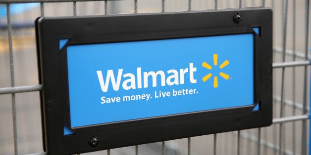 CHICAGO, IL - AUGUST 15: The Walmart logo is displayed on a shopping cart at a Walmart store on August 15, 2013 in Chicago, Illinois. Walmart, the world's largest retailer, reported a surprise decline in second-quarter same-store sales today. The retailer also cut its revenue and profit forecasts for the fiscal year. (Photo by Scott Olson/Getty Images)