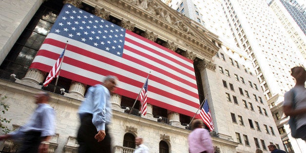 NEW YORK - SEPTEMBER 15: Pedestrians walk by the New York Stock Exchange September 15, 2008 in New York City. In morning trading, U.S. stocks suffered a steep loss after news of Merrill Lynch & Co. Inc was selling itself to Bank of America Corp and Lehman Brothers Holdings Inc. filed for Chapter 11 bankruptcy protection. (Photo by Spencer Platt/Getty Images)