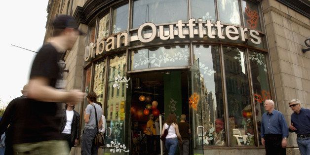 NEW YORK, NY - APRIL 22: Pedestrians pass in front of 'Urban Outfitters' on 6th Ave. and 14th street in Manhattan. Urban Outfitters, due to popular demand and high stock prices, is expanding their chain, hoping to become a mall mainstay like other clothing retailers such as 'the Gap'. (Photo by Scott Eells/Getty Images)