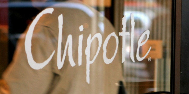 UNITED STATES - JANUARY 17: A customer enters a Chipotle Mexican Grill restaurant in the Brooklyn borough of New York, Wednesday, January 17, 2007. McDonald's Corp., the world's largest restaurant company, said fourth-quarter profit doubled on higher sales of chicken snack wraps and a gain from its spinoff of Chipotle Mexican Grill Inc. (Photo by Daniel Barry/Bloomberg via Getty Images)