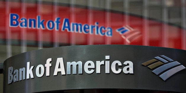 UNITED STATES - FEBRUARY 23: A Bank of America logo hangs above a bank branch entrance in New York, U.S., on Monday, Feb. 23, 2009. Citigroup Inc. and Bank of America Corp., two of the three biggest U.S. banks, climbed in New York trading after regulators said they may give lenders more capital to revive the banking system. (Photo by Jin Lee/Bloomberg via Getty Images)