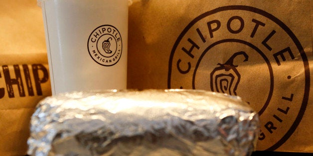 A steak burrito is arranged for a photograph with a drink and bags of chips at a Chipotle Mexican Grill Inc. restaurant in Hollywood, California, U.S., on Tuesday, July 16, 2013. Chipotle Mexican Grill Inc. is scheduled to release earnings data on July 18. Photographer: Patrick T. Fallon/Bloomberg via Getty Images