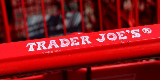Trader Joe's Co. logo is displayed on shopping carts outside of a store in Emeryville, California, U.S., on Friday, Sept. 13, 2013. Trader Joe's Co., the closely held grocery store chain, will end health benefits for part-time workers next year, directing them instead to anew insurance marketplaces as companies revamp medical coverage to fit the U.S. Affordable Care Act. Photographer: David Paul Morris/Bloomberg via Getty Images