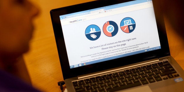 MIAMI, FL - OCTOBER 08: A message is seen on the computer indicating that there are too many visitors on the Affordable Care Act site to continue, as navigator Nini Hadwen helps people shop for health insurance during a navigation session put on by the Epilepsy Foundation Florida to help people sign up for health insurance under the Affordable Care Act on October 8, 2013 in Miami, Florida. The United States government continues to be partially shut down as Republicans hold out hope to cut funding for the Affordable Care Act. (Photo by Joe Raedle/Getty Images)