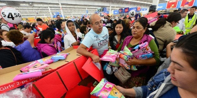 People get an early start on Black Friday shopping deals at a Walmart Superstore on November 22, 2012 in Rosemead, California, as many retailers stayed opened during the Thanksgiving celebrations, evidence that even this cherished American family holiday is falling prey to the forces of commerce. AFP PHOTO / Frederic J. BROWN (Photo credit should read FREDERIC J. BROWN/AFP/Getty Images)