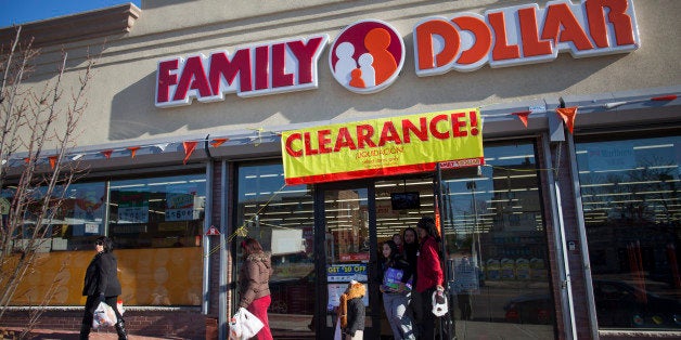 Shoppers exit a Family Dollar Stores Inc. store in Belleville, New Jersey, U.S., on Thursday, Jan. 3, 2013. Family Dollar Stores Inc., the second-largest U.S. dollar store chain, tumbled the most in more than 12 years after cutting its fiscal 2013 earnings forecast, saying consumers are reluctant to spend on more-profitable discretionary items. Photographer: Michael Nagle/Bloomberg via Getty Images