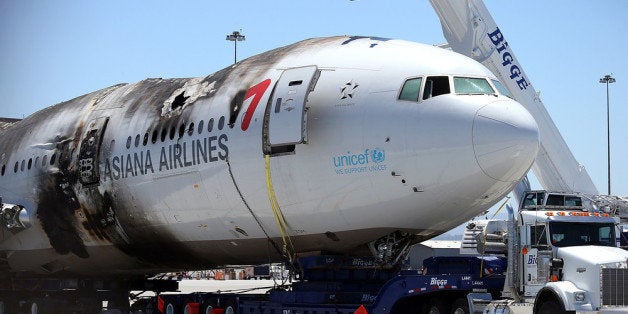 SAN FRANCISCO, CA - JULY 12: The wrecked fuselage of Asiana Airlines flght 214 sits in a storage area at San Francisco International Airport on July 12, 2013 in San Francisco, California. Nearly one week after Asiana Airlines flight 214 crash landed at San Francisco International Airport, the wrecked fuselage was moved from the runway. Two people died in the crash and hundreds were injured. (Photo by Justin Sullivan/Getty Images)