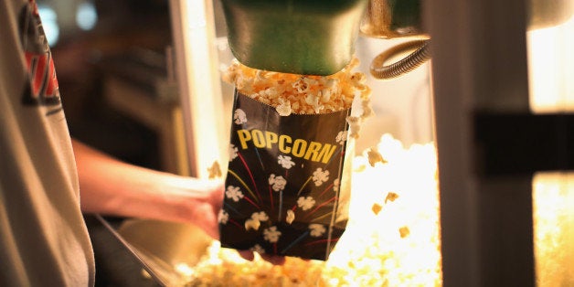 NELIGH, NE - SEPTEMBER 28: Dillon Smith gets popcorn for customers in the concession stand at the TK/Starlite Drive-In Theate